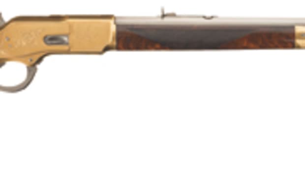 Engraved Winchester Deluxe Model 1873 lever-action rifle