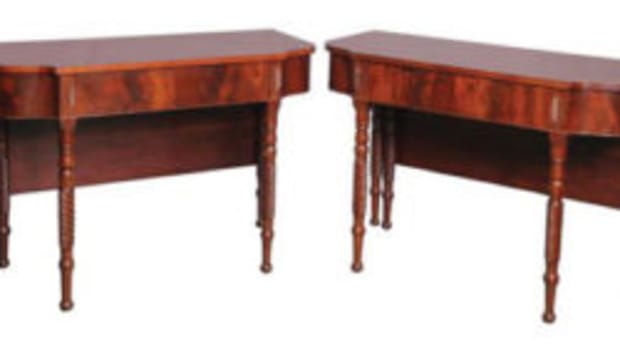 These Federal D end console tables have drop leaves attached that would rest on a rectangular center section.