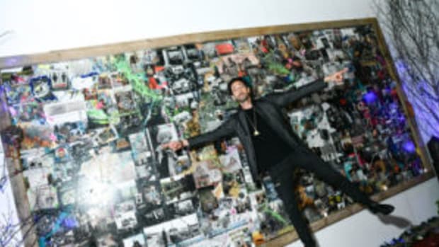 Adrien Brody in front of "Metamorphosis" at Art New York.