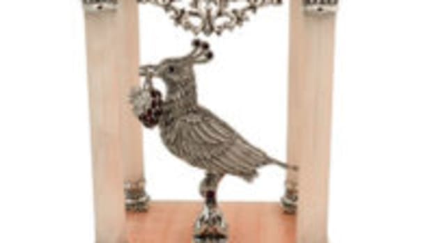 Exquisite, highly detailed, handcrafted sterling, jewel-crested silver bird perched within pink onyx gazebo. Courtesy www.nadavart.com 