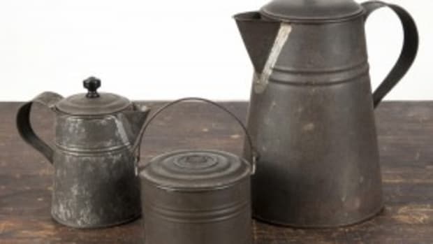 Three pieces of early American tin, 19th c. to include a coffeepot, 8 3/4'' h., a cream pitcher, 5 1/4'' h., and a small berry pail, 3'' h., carry a presale estimate of $60 to $80 into the sale. (Photo courtesy Pook & Pook)