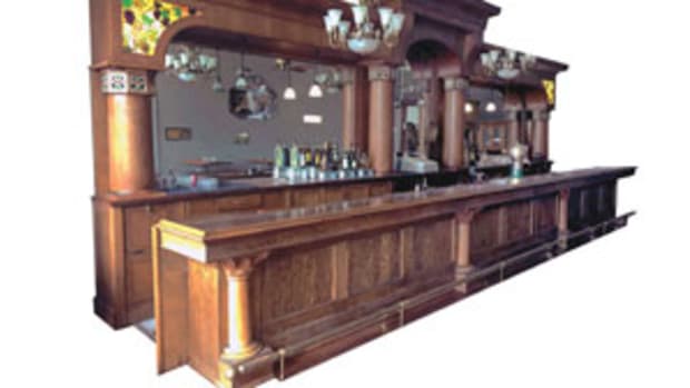  This triple-arch bar, manufactured by The Brunswick-Balke-Collender Co. of New York and Chicago, circa 1900, is one of the featured lots at Donley Auctions Fall Classic Nov. 14-16. The beautiful oak and leaded glass-lit ensemble, 30’ x 12’, would be the centerpiece of any business or home party room. Estimated value is $40,000-$50,000. Image courtesy of Donley Auctions