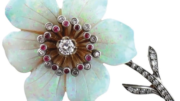 An enchanting six-petal opal flower displays flashes of electric blues, greens and magenta pinks; 18k gold and silver, with full and single-cut diamonds and rubies; $2,700. Courtesy of Syosset Antiques: rubylane.com/shop/jewelmanity
