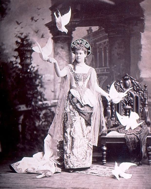 Alva Vanderbilt at her official opening of the chateau in March 1883, in her costume of a "Venetian Renaissance Lady." The photographer apparently added the birds in later, for whatever reason.