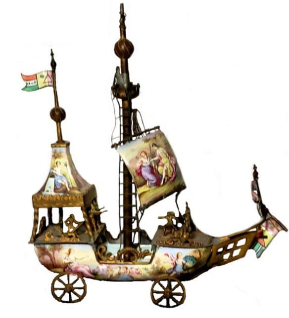 This nineteenth century, hand-painted, enamel, Austrian, silver and gilt ship on wheels was made strictly for ornamentation.