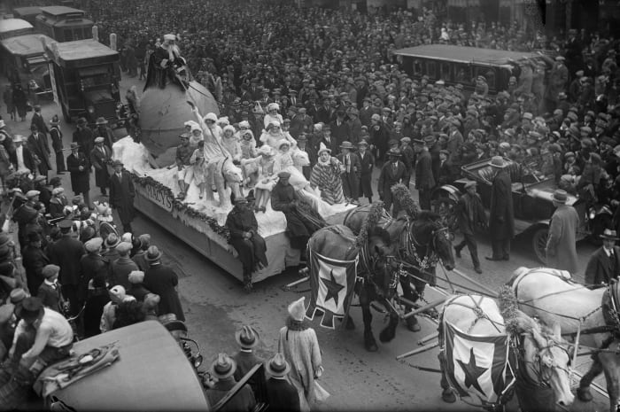 Santa Claus rides a parade float pulled by a team of horses down Broadway Street during the annual Macy's Thanksgiving Day Parade in New York City in 1925.