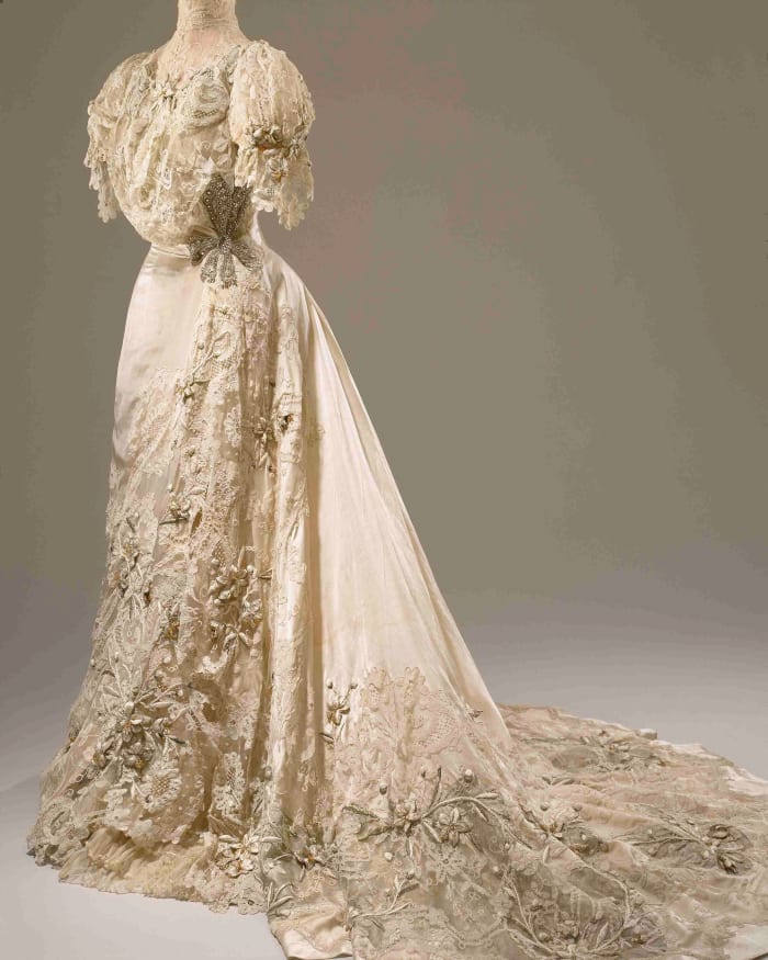 When Post wed Edward Close on Dec. 5, 1905, she wanted “the most glamorous wedding gown you could think of,” and this Hitchins & Balcom Edwardian wedding gown features lace, silver tissue, rhinestones, faux pearls, wired lilies, and cotton floss.