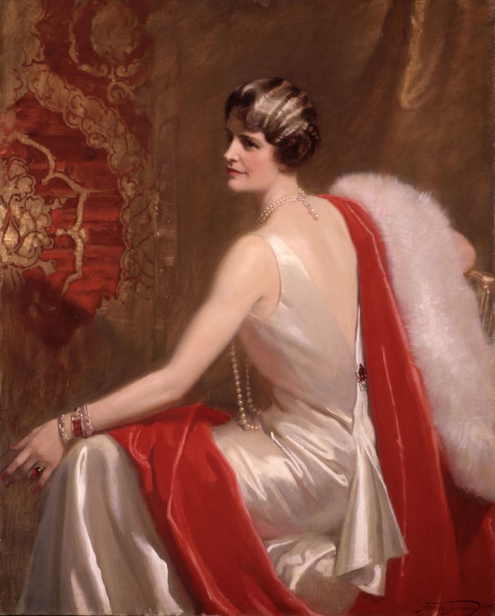 Post wore the dress in this portrait painted by Frank O. Salisbury (1874-1962) New York City, 1934. She accessorized it with pearls and red jewels.