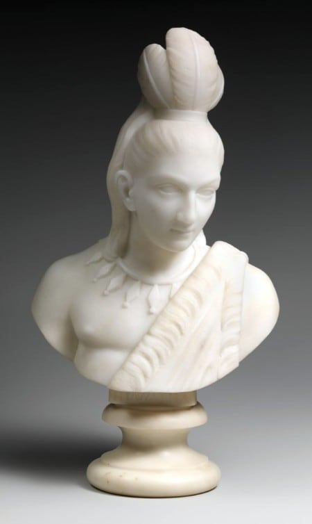 Lewis’ multiracial identity and gender were formative in her selection of subjects. Between 1866 and 1872, she completed a series of marble sculptures on the popular theme of Hiawatha (shown here) and Minnehaha (shown below), drawn from Henry Wadsworth Longfellow’s epic poem, "The Song of Hiawatha" (1855). These cabinet-sized busts represent the star-crossed lovers from once-warring nations and blend an idealized treatment of form with Native American dress and accessories.