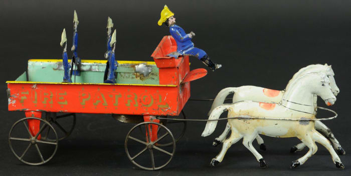 The only known complete example of the Althof Bergmann Fire Patrol Wagon, this early hand-painted fire toy sold for $26,000 against a high estimate of $7,000; 16" l.