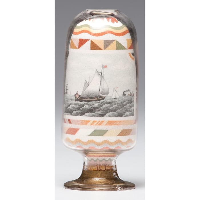 This inverted sand bottle with a nautical and patriotic theme, 6-1/4" h, realized $108,000 at Cowan’s in 2018.