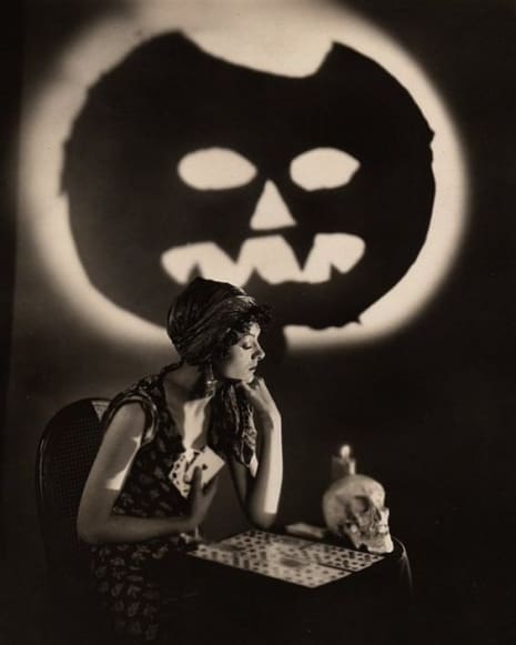 After reading the cards, actress Myrna Loy, who was named Queen of the Movies in a 1936 poll, is foretelling that we will all have a frightfully fun Halloween.