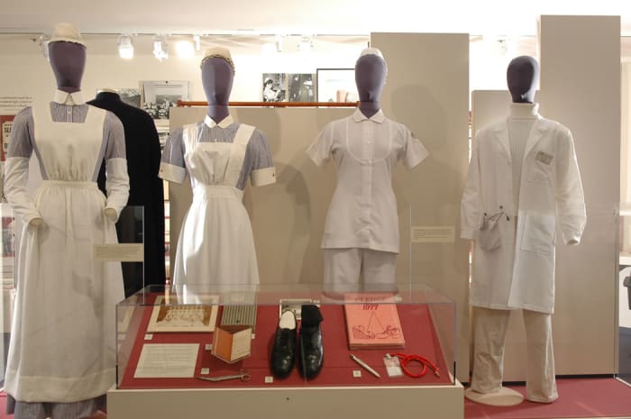 The various nursing uniforms in the museumâs collection that are on display.