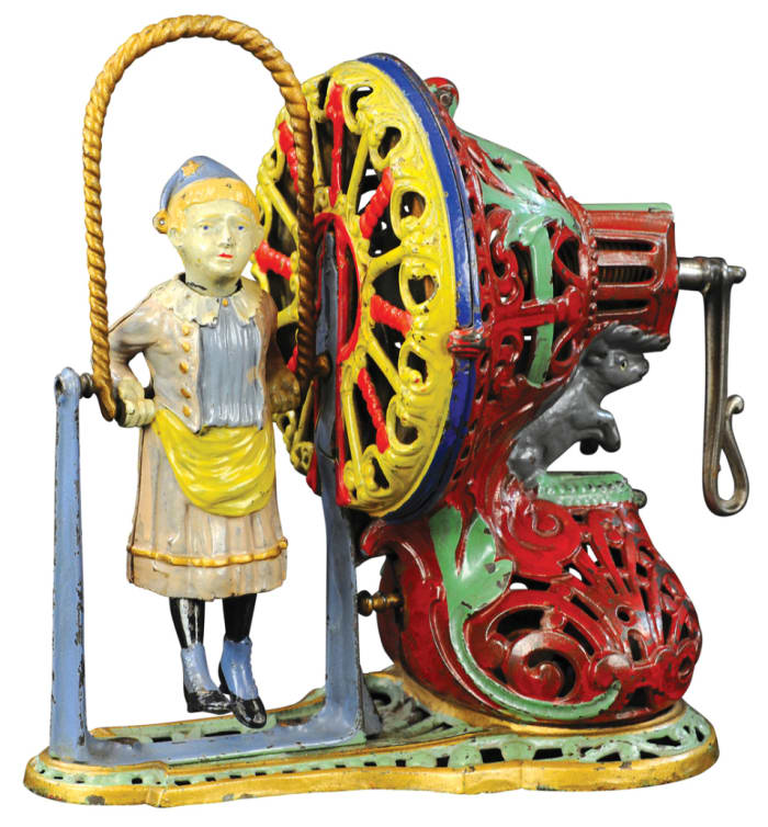 This pristine to near-mint  J & E Stevens Girl Skipping Rope cast-iron mechanical bank from the Aaron and Abby Schroeder Collection sold for $156,000, a record for the form.