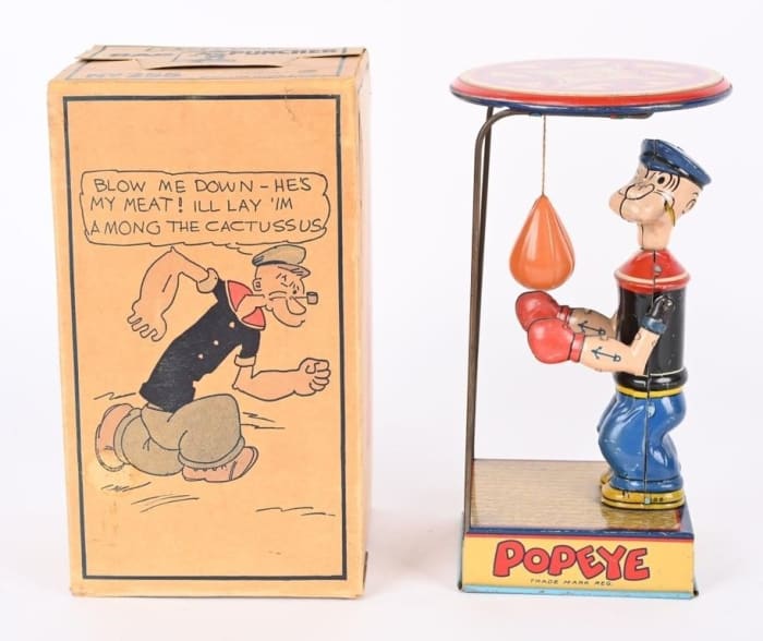 Chein tin wind-up Popeye Overhead Puncher, all original and complete with celluloid punching bag. Excellent to near-mint condition with original pictorial box. Sold for $11,400 against an estimate of $4,000-$5,000.