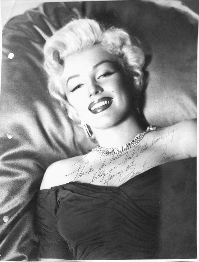Authentic Marilyn Monroe autographed photo to a wardrobe stylist named Anne, with the cheeky inscription: "To Anne -Thanks for holding my belly in - but lets leave my fanny out. -Marilyn Monroe"; estimate: $3,000-$4,000.