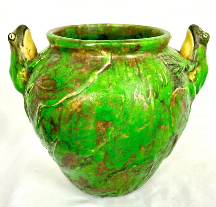 Two frogs climb  each side of this Coppertone vase  or bowl, circa 1920s, 7-7/8” h, 8-3/8”  w; $650.