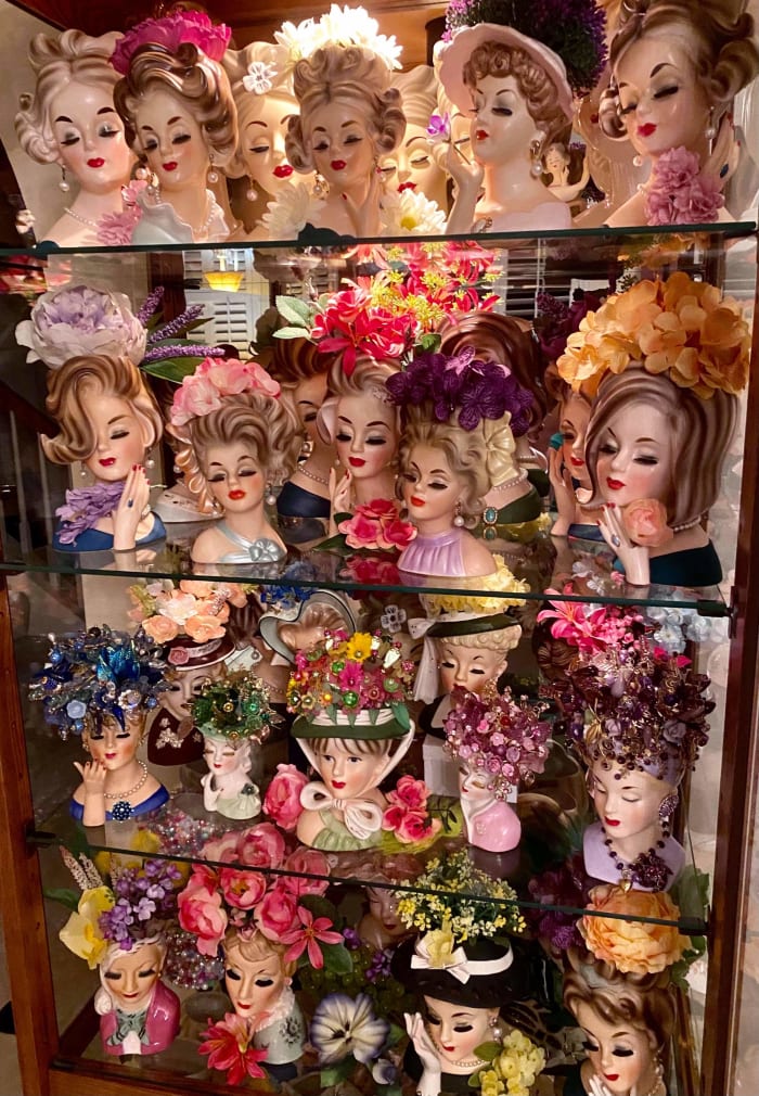 Some of the lady head vases in collector Wayne Geeslin's collection, showing all different styles.