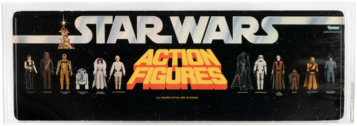 Double-sided shelf display header with text and images of Kenner’s first 12 Star Wars action figures sold for $18,172.