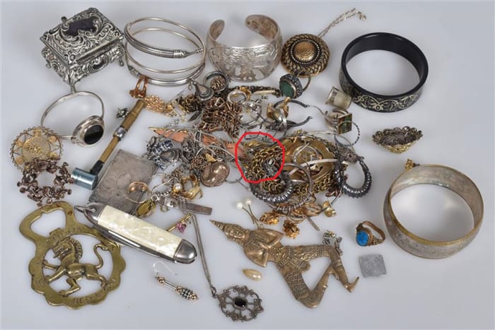 The gold Viking ring, circled in red, was found in this pile of costume jewelry.