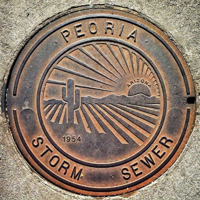 Peoria, Arizona, flaunts its desert pride in this classic manhole cover.