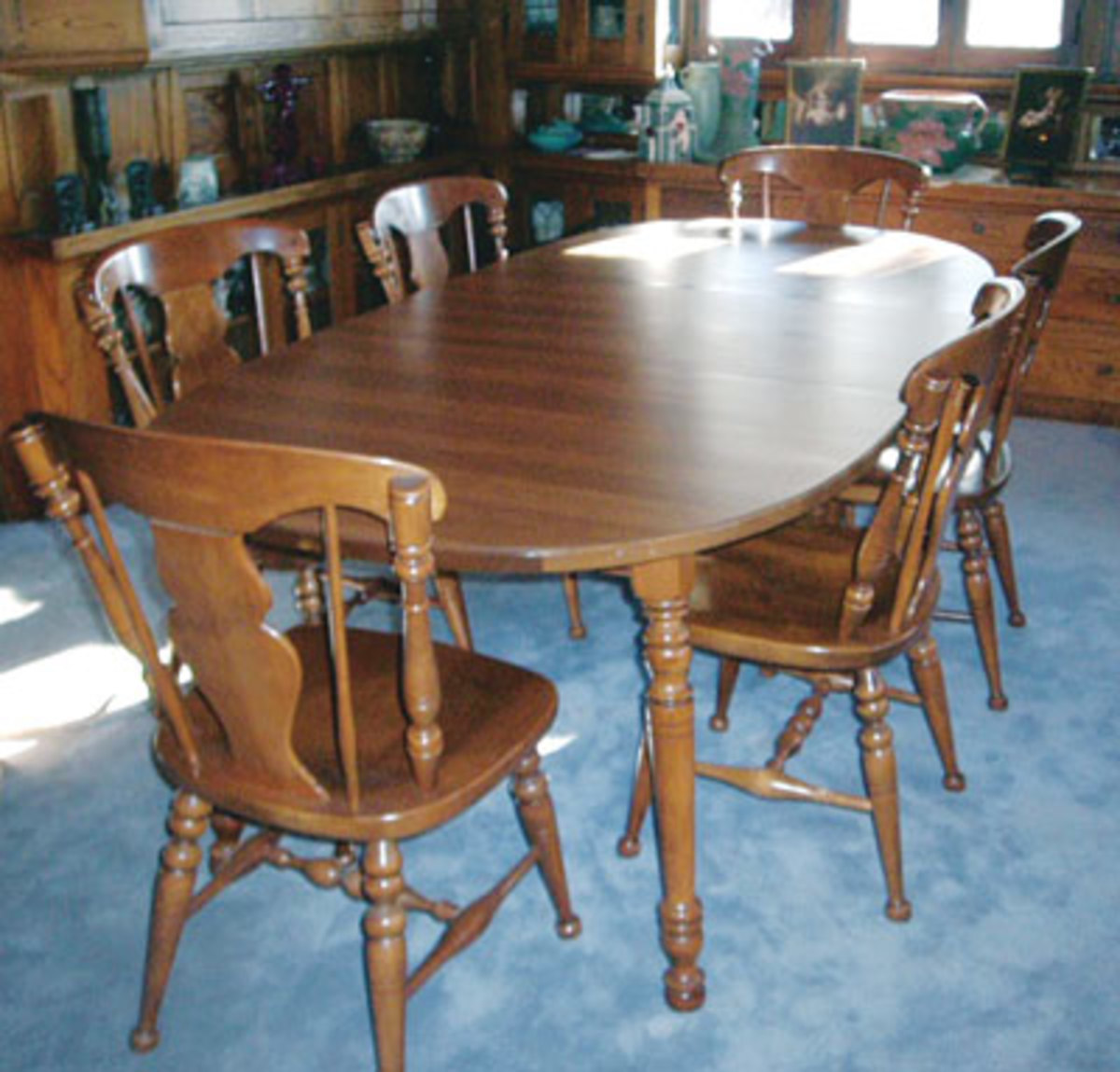 This table, while it seems to match the Heywood-Wakefield chairs and hutch, was actually made by Tell City of Tell City, Ind.