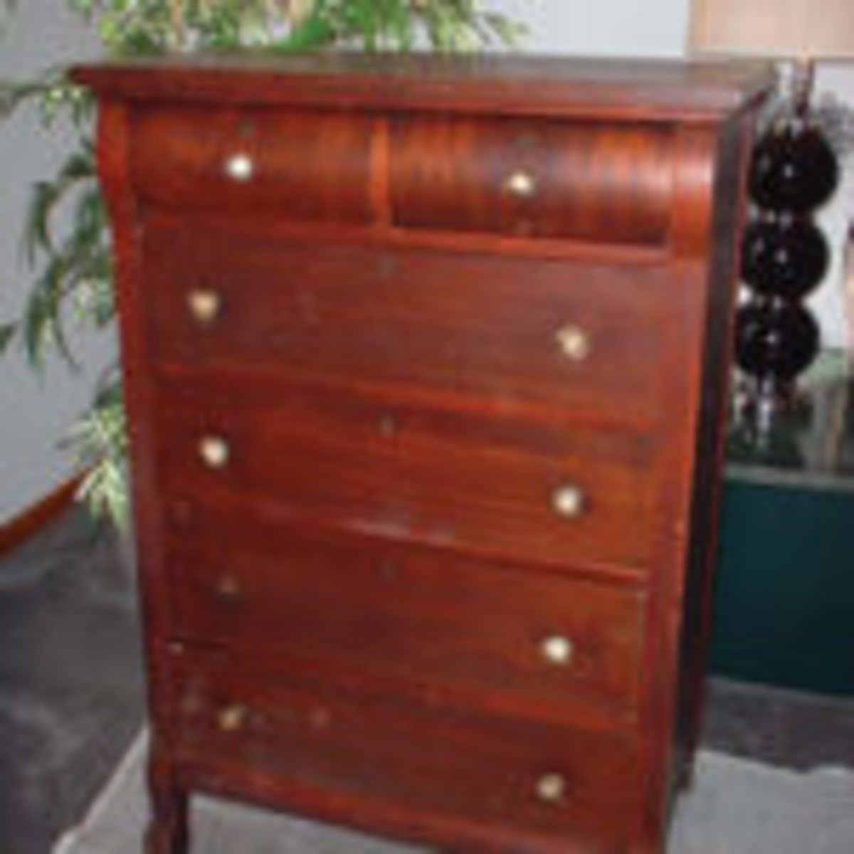 A descendant of the simple chest, this slender chest of drawers was called a chiffonier in France. 