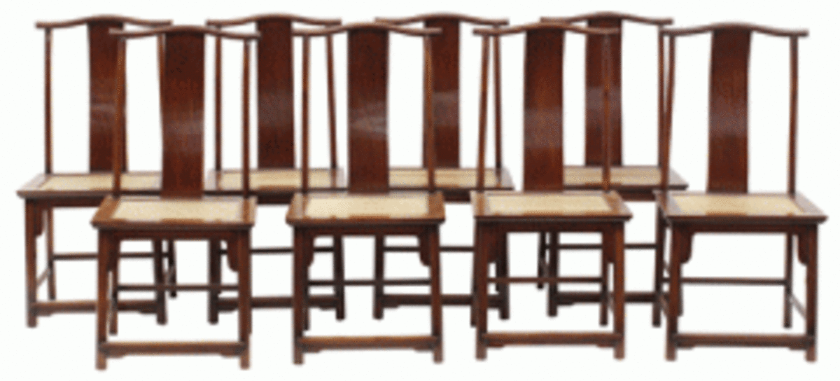 This set of eight huanghuali and hardwood side chairs, each with a woven seat, will be offered at $120,000 to $140,000. (Photo courtesy Clars)