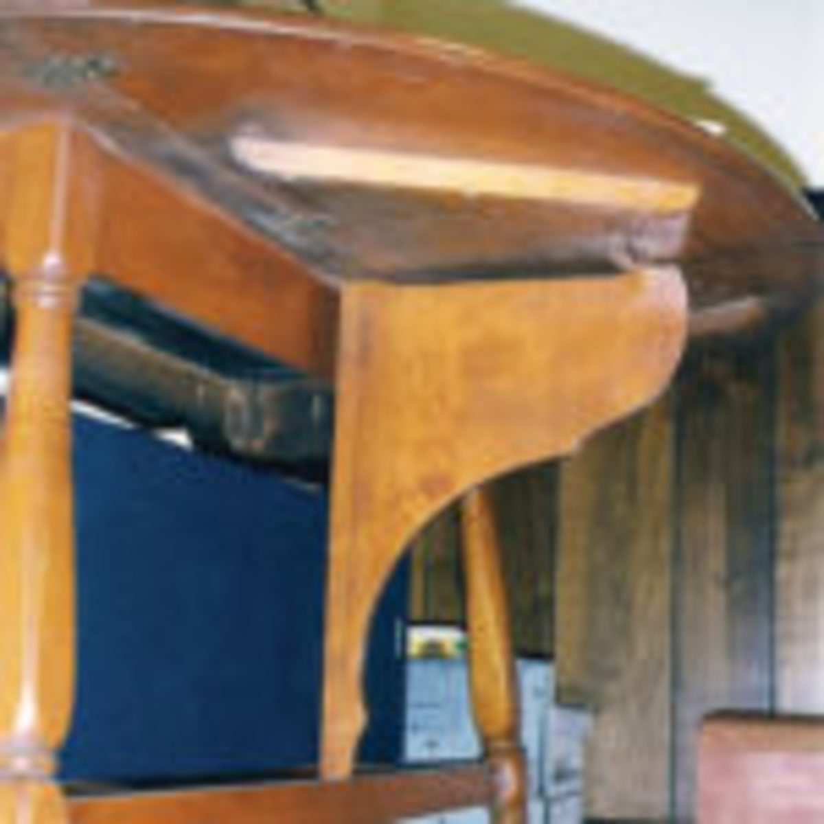This reproduction shows the support mechanism of an early eighteenth century butterfly drop leaf table.