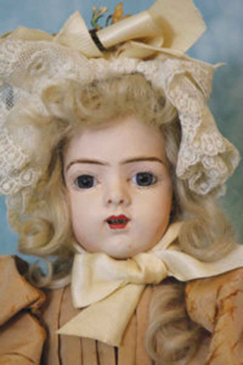  One of the original papier mâché Bru twins, glass eyes, mob cap. From the author’s collection.