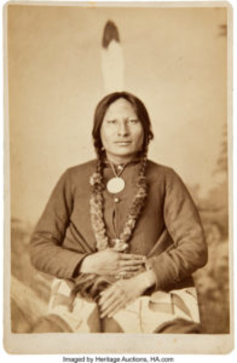  In this photo taken in the late 1800s by O.S. Groff, Sioux Leader Rain-in-the-Face wears a military jacket and a Presidential Peace Medal, and a large eagle feather in his braided hair. Images courtesy of Heritage Auctions