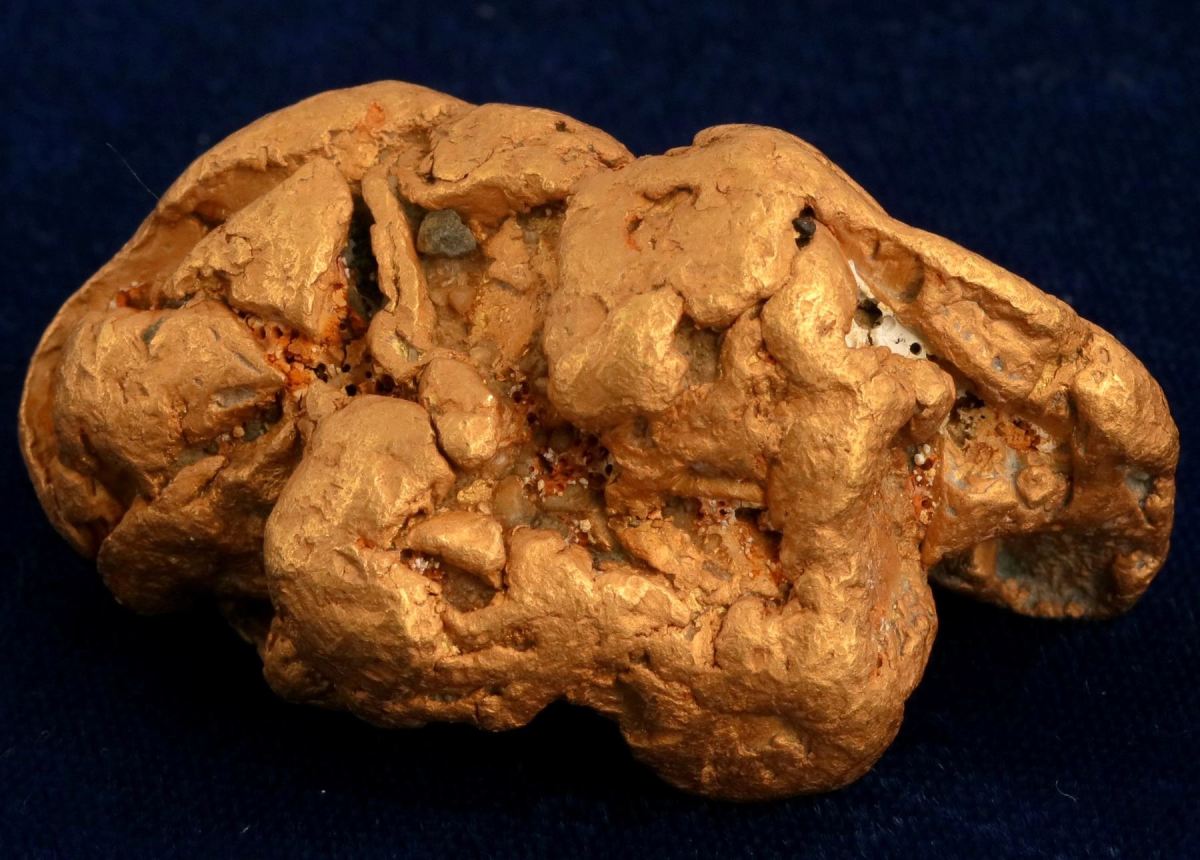 Beautiful 4.51 troy ounce gold nugget from the Atlin mining district, just east of Skagway in Yukon, Alaska, 2 ½ inches by 1 ½ inch ($10,845).