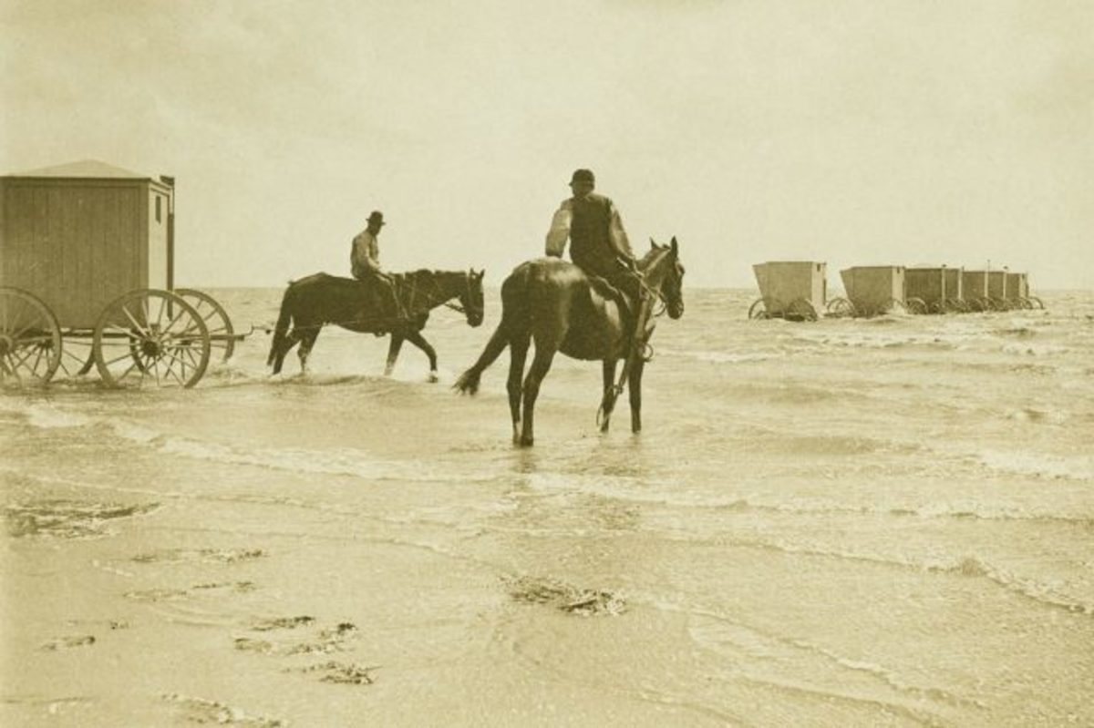 A horseman pulls a machine into the water, 1895.