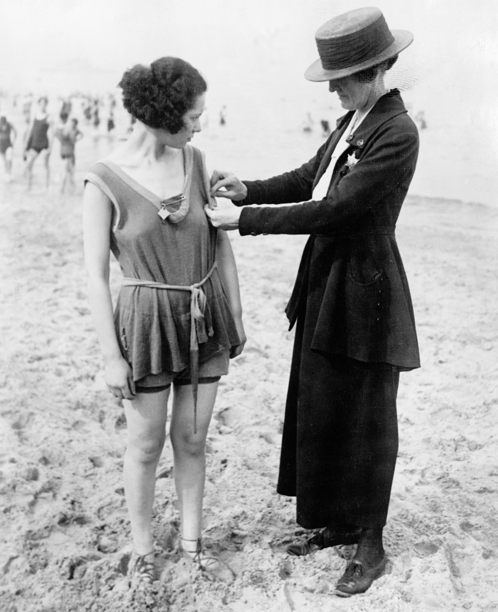 A Chicago policewoman makes sure a swimmer "measures up" to the city's moral code. 