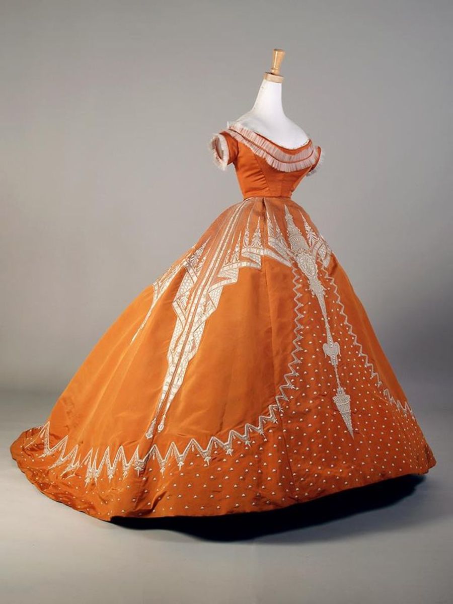 Orange evening dress with white embroidery, French, ca. 1865-67, by Charles Frederick Worth.