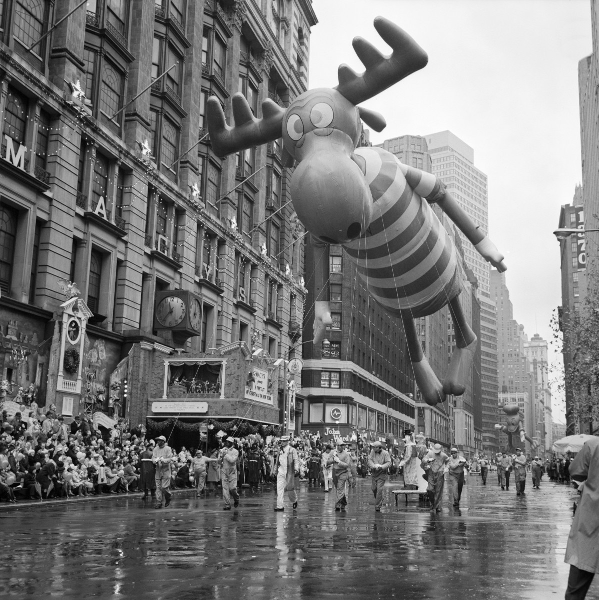 A giant Bullwinkle float looms over the crowd in the 1962 Macy’s Thanksgiving Day Parade. Despite the weather, a large crowd came out to see the parade on a rainy Thanksgiving Day.