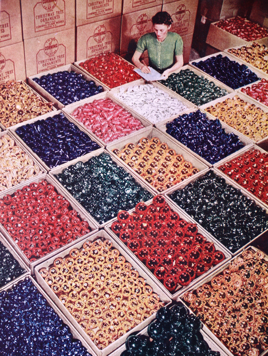 An factory worker is surrounded by Shiny Brites.