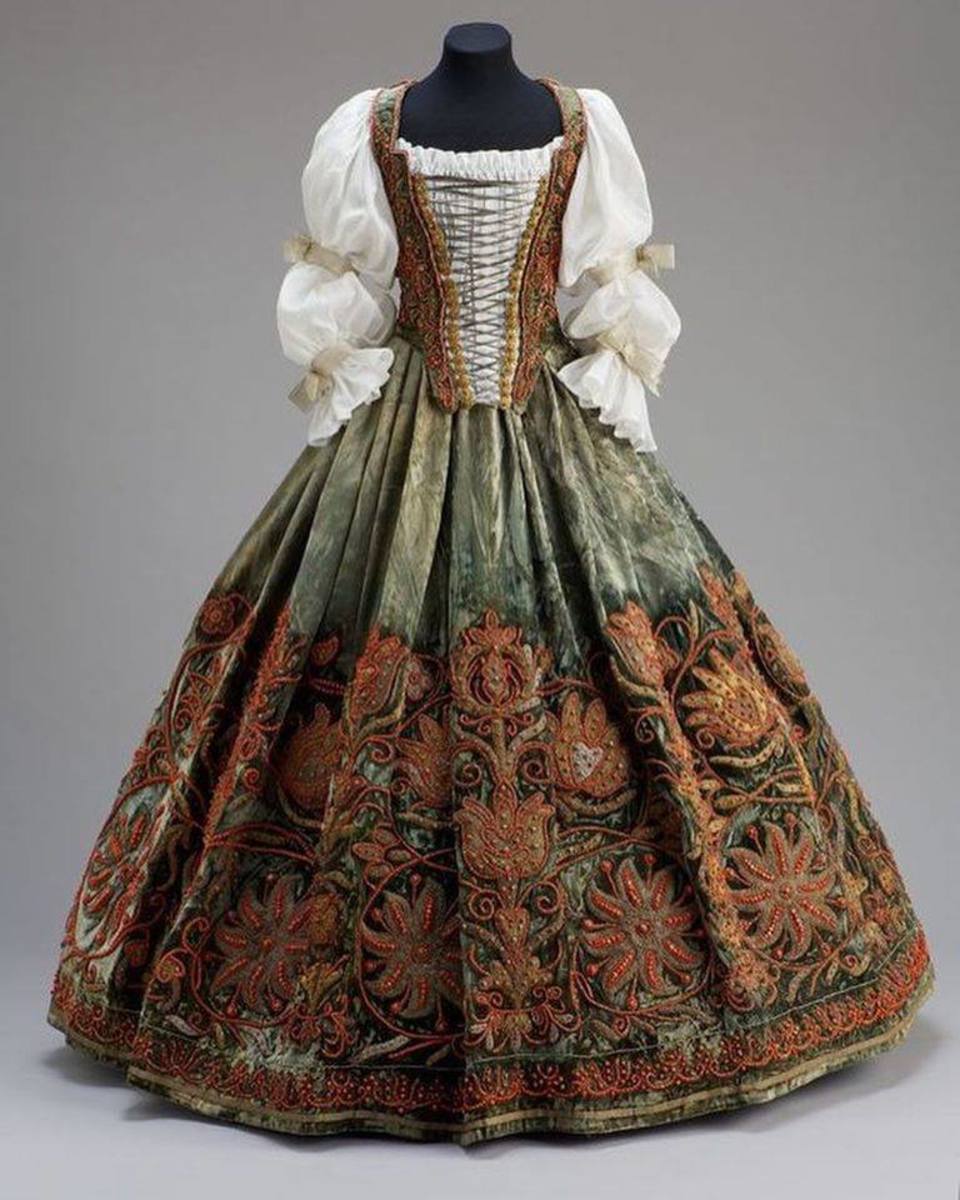 A Hungarian costume featuring a cambric blouse and velvet skirt, mid-17th century.