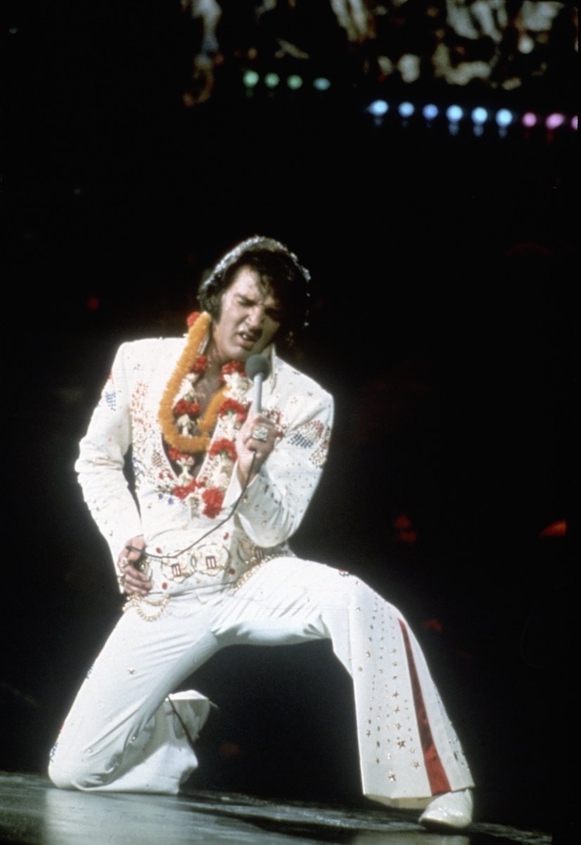 This is the image most people associate Elvis with: the iconic white jumpsuit. Here he performs onstage at the International Convention Center in Honolulu, Hawaii, on January 14, 1973.
