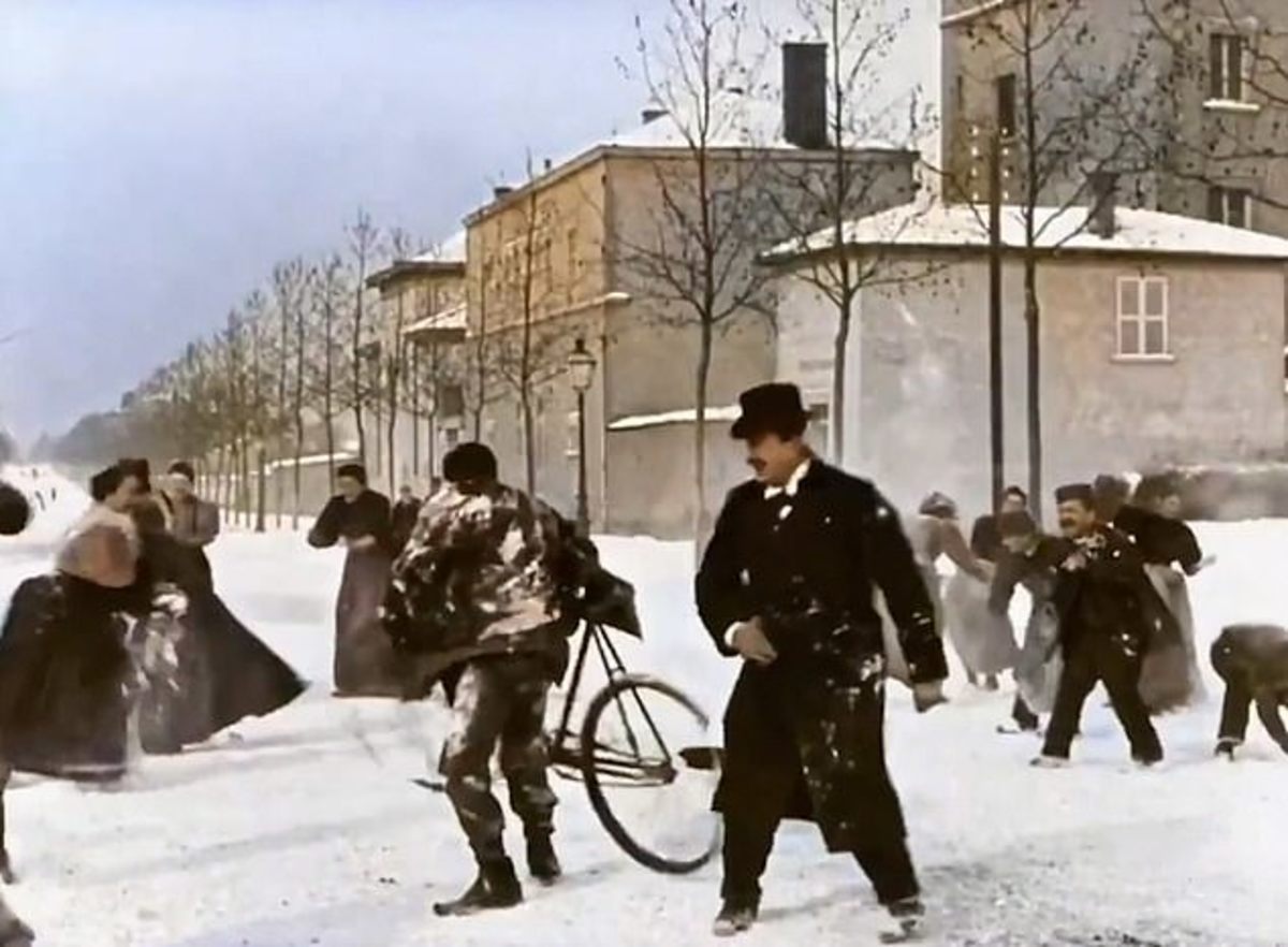 A dapper gentleman, snow-covered cyclist, and at far left, a woman in a bustle packing a snowball.