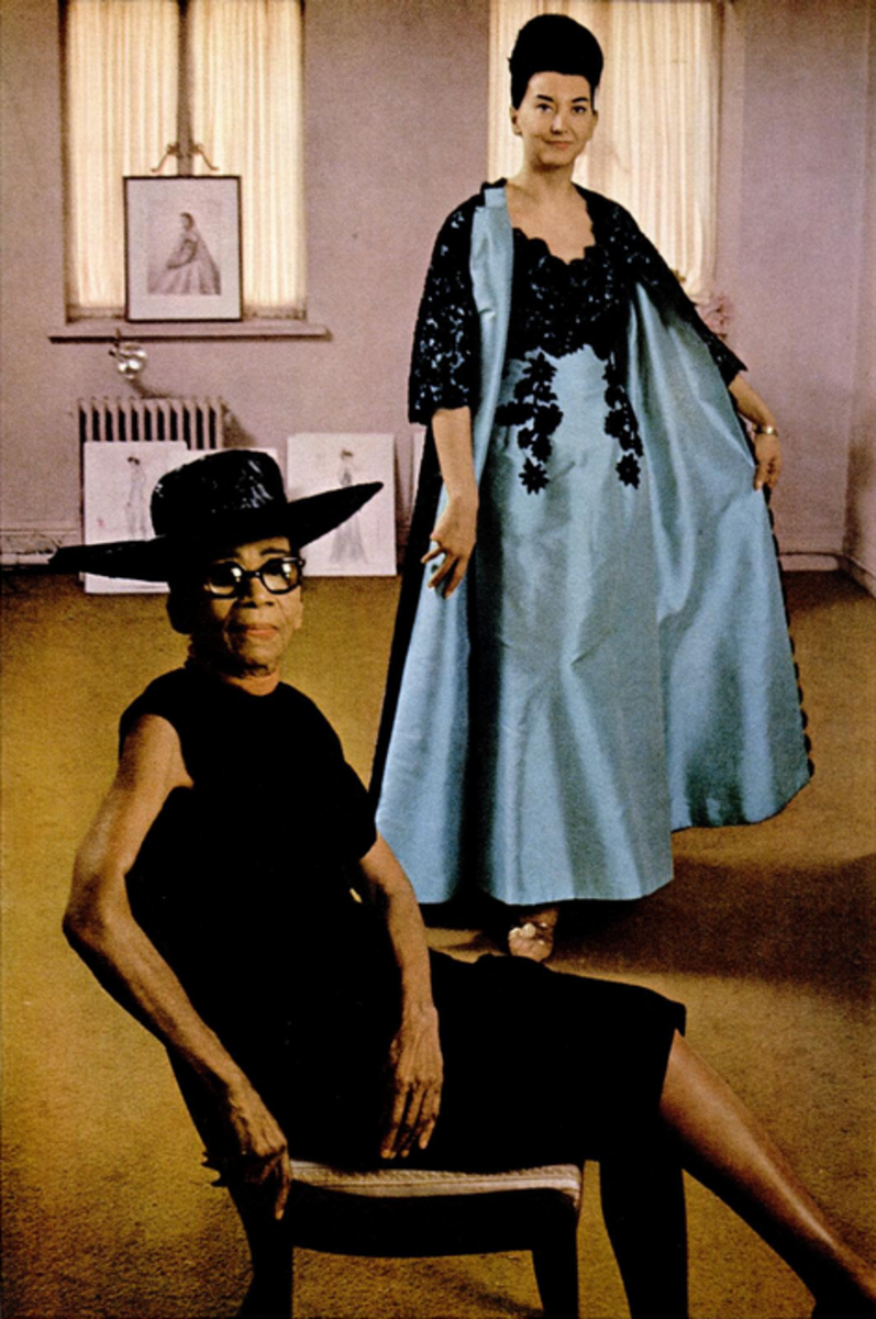 Ann Lowe, at 67, in her New York atelier, with a model posing in her one of her designs in Ebony Magazine, 1966. Every dress Lowe designed was hand-sewn and one-of- a- kind, tailor made to fit the wearer's exact measurements. Her superb work and attention to found an audience among New York City's most affluent social circles.