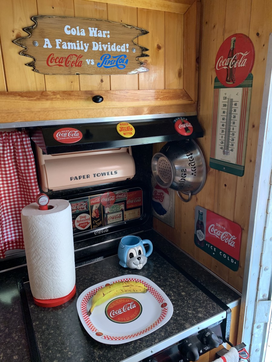 A sign in the trailer’s kitchen area reinforces the theme of trailer: ‘Cola War: A Family Divided! Coca-Cola vs. Pepsi-Cola.’