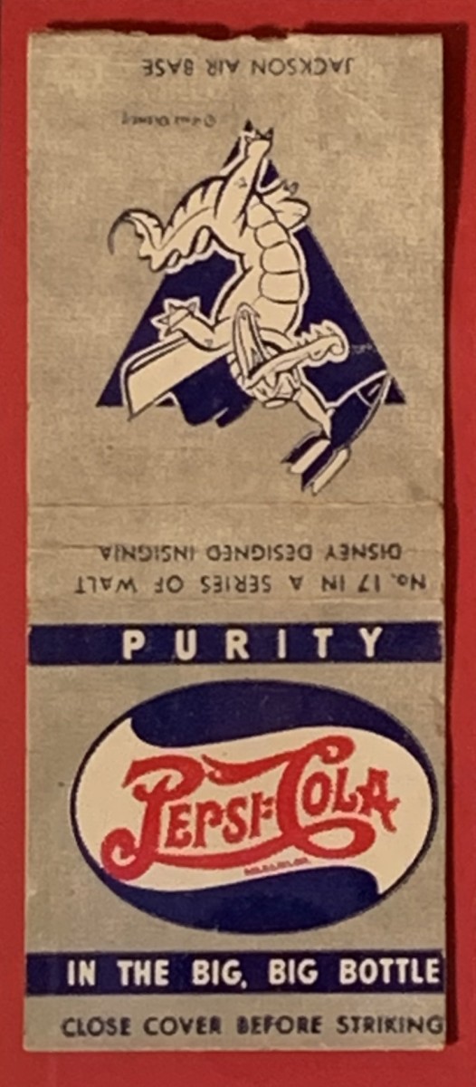 A framed wall hanging in the trailer features a book of matches with a pre-1951 Pepsi-Cola logo on one side and a Disney-designed cartoon insignia for Jackson Air Base on the other side. Rick bought it unframed at an antique store for $2 (a steal, he thinks).