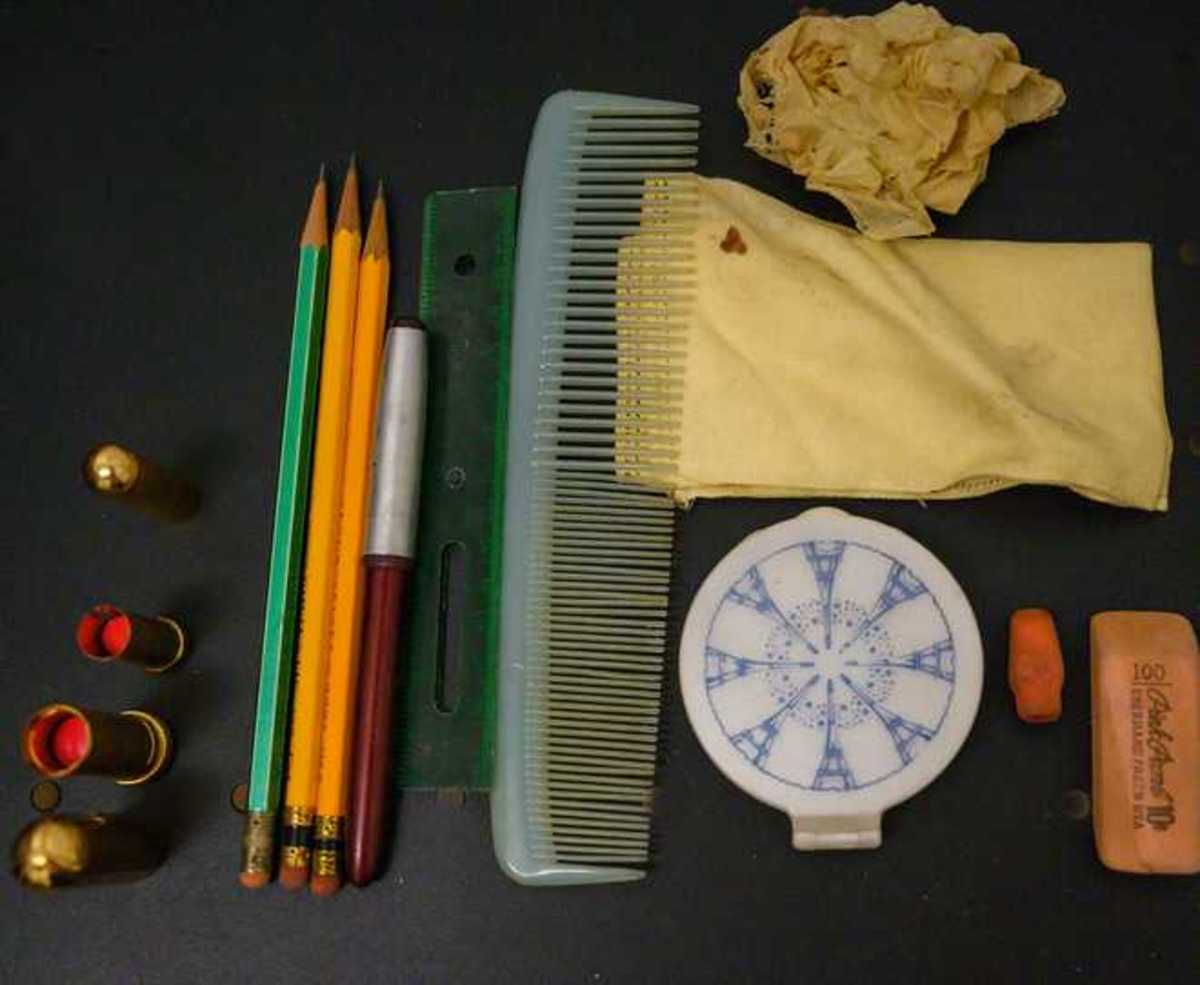 Various items that were in Patti’s purse including lipstick, a ruler, comb, pencils and erasers.