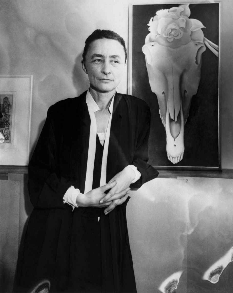 Georgia O’Keeffe next to her painting Horse Skull with White Rose at an exhibit of her work titled “Life and Death.”