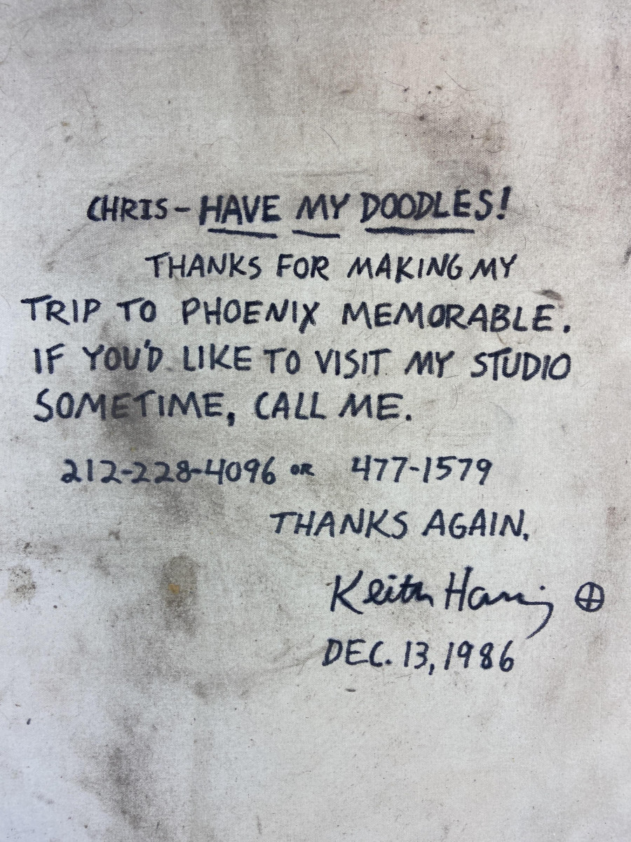 On the back of the untitled Keith Haring painting is this note to the mystery recipient of the work.