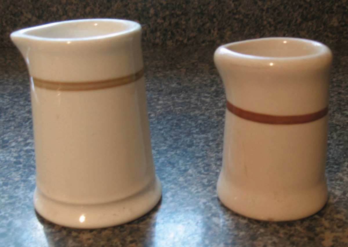 Two creamers with a simple band design. The one on the right was made by Shenango.