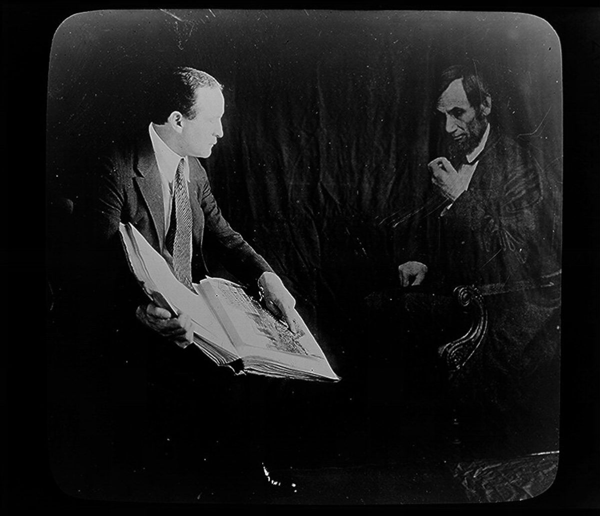 Harry Houdini and the ghost of Abraham Lincoln, in a photo created by the famous illusionist to debunk spirit photographs. This was published between 1920 and 1930.