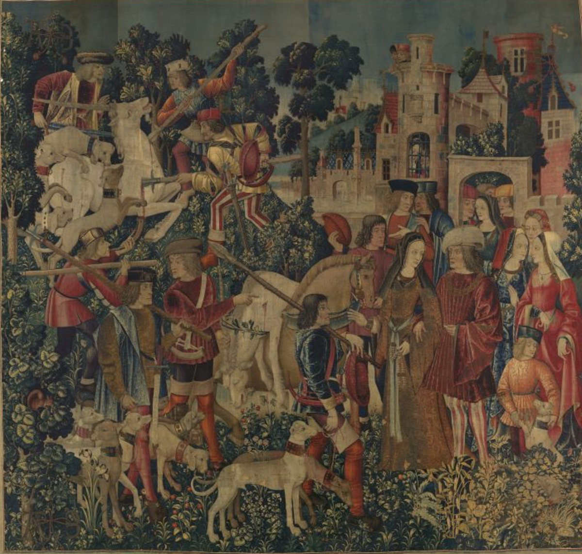 Tapestry 6: The Unicorn is Killed and Brought to the Castle. In this tapestry, separate scenes are depicted. In the upper left-hand corner, the unicorn is killed, and shown front and center is the transportation of the dead unicorn on a horse’s back. In some contexts, the unicorn is an allegory for Christ; the large holly tree (often a symbol of Christ’s Passion) rising from behind his head may conceivably be linked to this association. In the other scene, at right, a lord and lady receive the body of the unicorn in front of their castle. They are surrounded by their attendants, with more curious onlookers peering through windows of the turret behind them. The dead animal is slung on the back of a horse, his horn already cut off but still entangled in thorny oak branches—perhaps an allusion to the Crown of Thorns.
