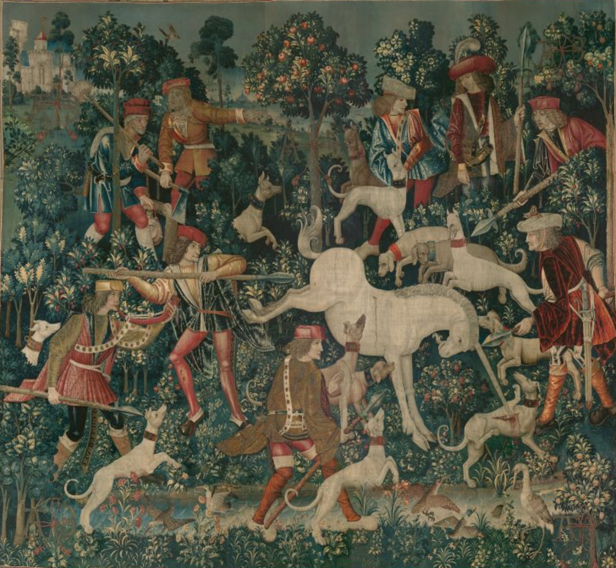 Tapestry 4: The Unicorn Defends Itself. Here the injured unicorn is being held at bay by three hunters ready to pierce him with their lances. He gores a greyhound with his horn and kicks at one of the huntsmen. The huntsmen and other figures are garbed in the fashions of the turn of the sixteenth century and their headdresses and hairstyles also reflect contemporary tastes. The mastery of the weavers is evident in the representation of different materials and textures in the costumes, such as brocade, velvet, leather, and fur.